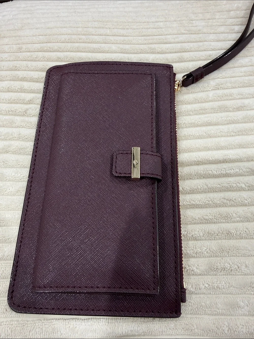 kate spade Plum Textured Wristlet Clutch with Gold Logo